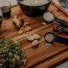 green vegetable on brown wooden chopping board