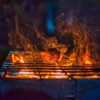 fire on black charcoal grill