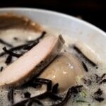 a close up of a bowl of food on a table