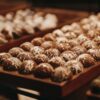a close up of a tray of doughnuts