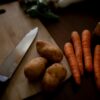 carrots on brown wooden chopping board