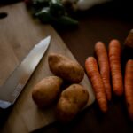 carrots on brown wooden chopping board