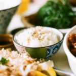 white and blue ceramic bowl with rice