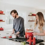 man and woman on kitchen